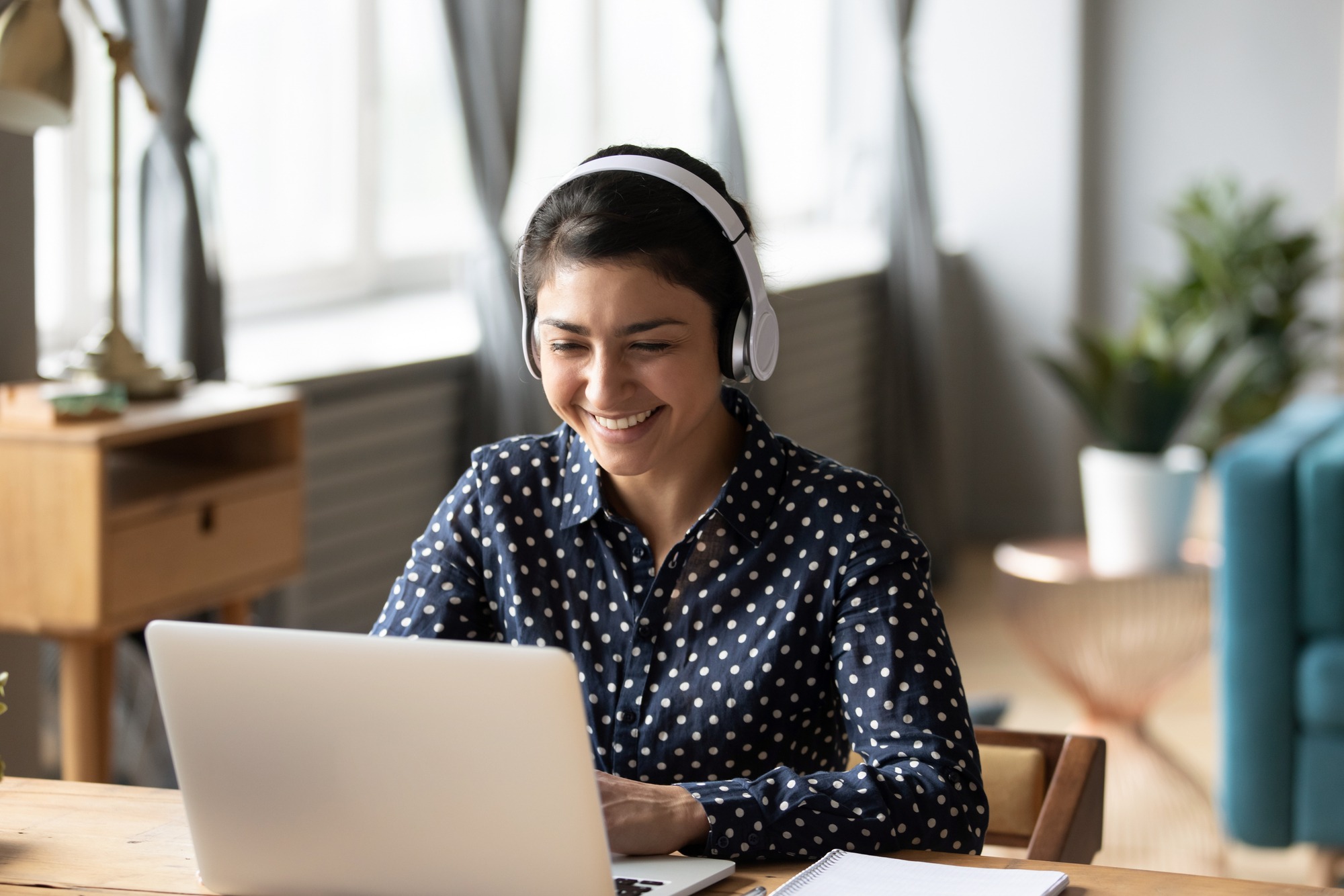 Happy woman working on her laptop